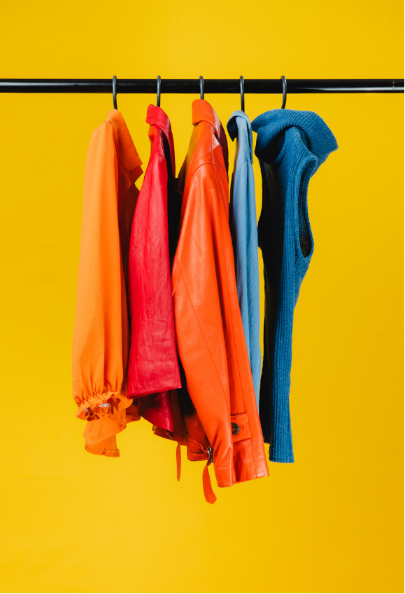 Colorful clothes on yellow background
